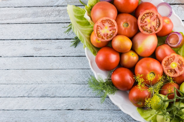 Closeup tomatoes plate with copy space