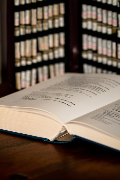 Free photo closeup vertical shot of a book on a table with blurred background