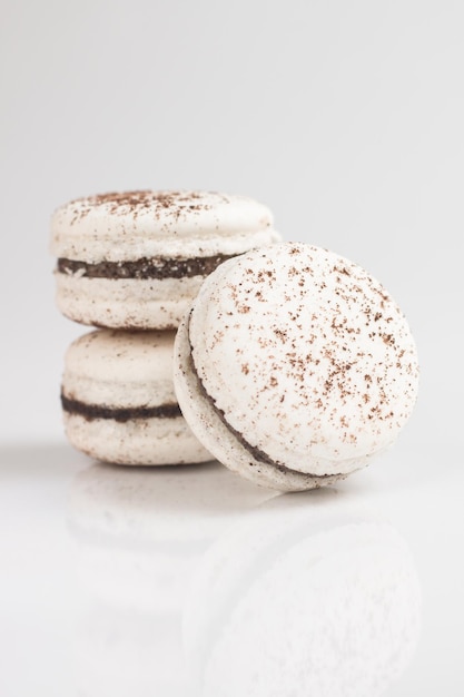 Closeup of white macaroons on a white background