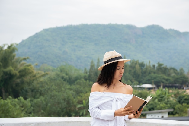 closeup woman hand hold the book to read