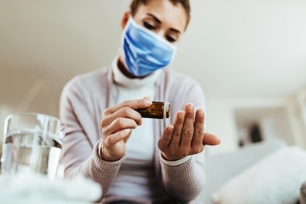 Free Photo closeup of woman with face taking prescription medicine at home