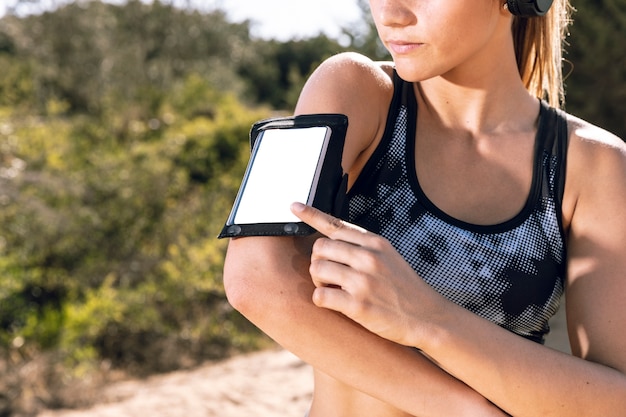 Free photo closeup woman with phone armband mock-up