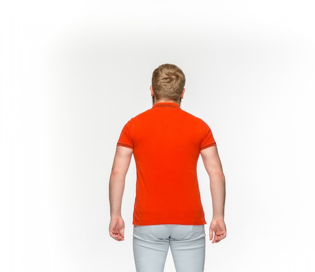 Free photo closeup of young man's body in empty red t-shirt isolated on white