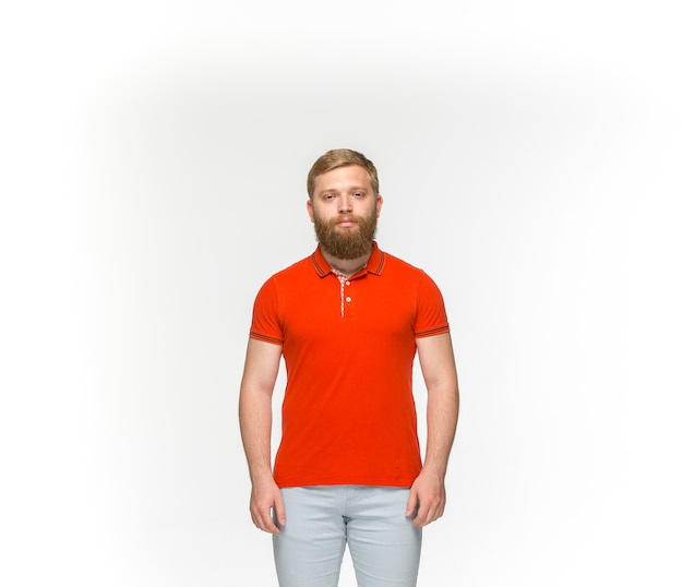 Free photo closeup of young man's body in empty red t-shirt isolated on white.