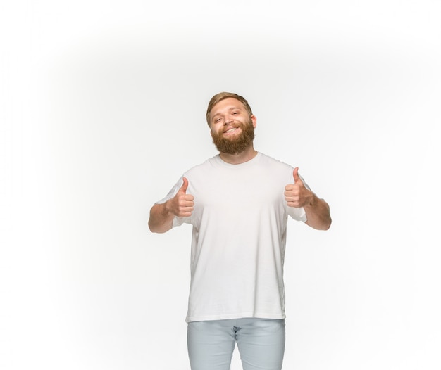 Free Photo closeup of young man's body in empty white t-shirt isolated on white