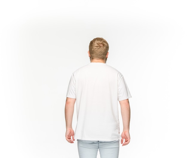 Free photo closeup of young man's body in empty white t-shirt isolated on white.