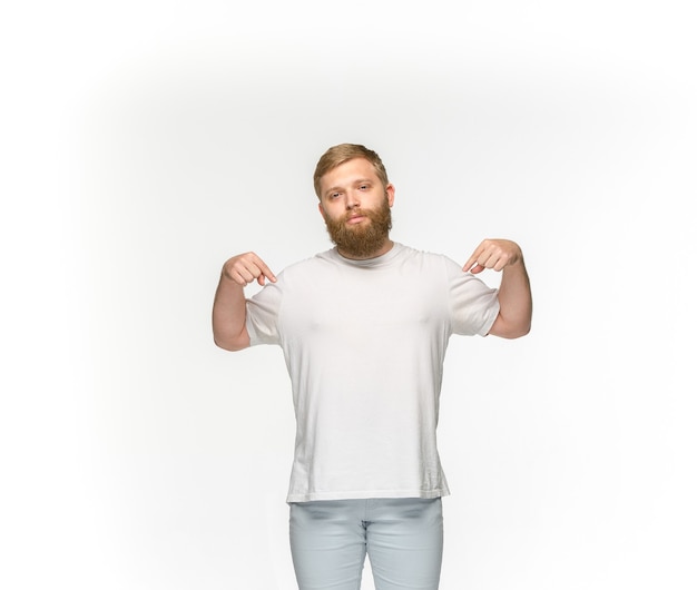 Free Photo closeup of young man's body in empty white t-shirt isolated on white