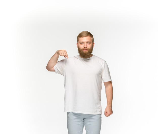 Free photo closeup of young man's body in empty white t-shirt isolated on white.