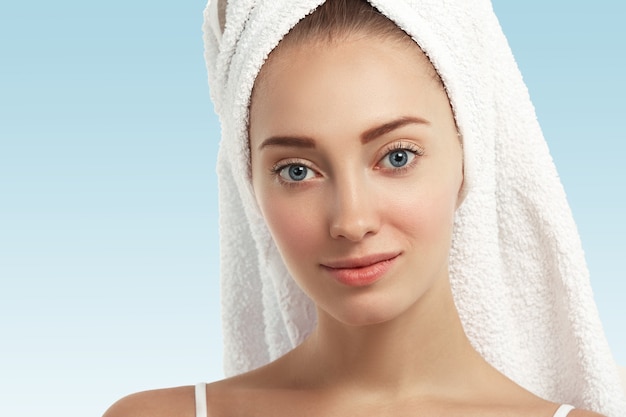 Free Photo closeup of young woman with towel on head