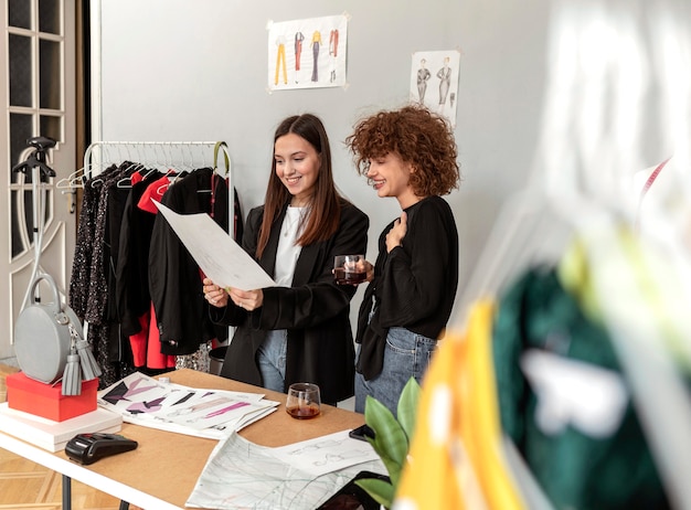 Clothes designers working at store