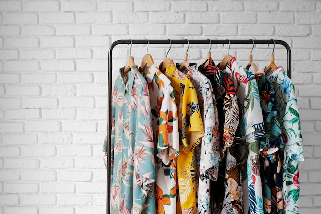 Free photo clothing rack with hawaiian shirts with floral print