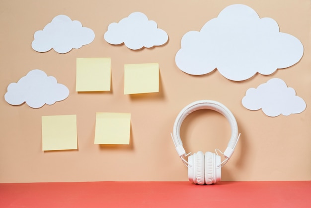 Free photo clouds and sticky notes near headphones