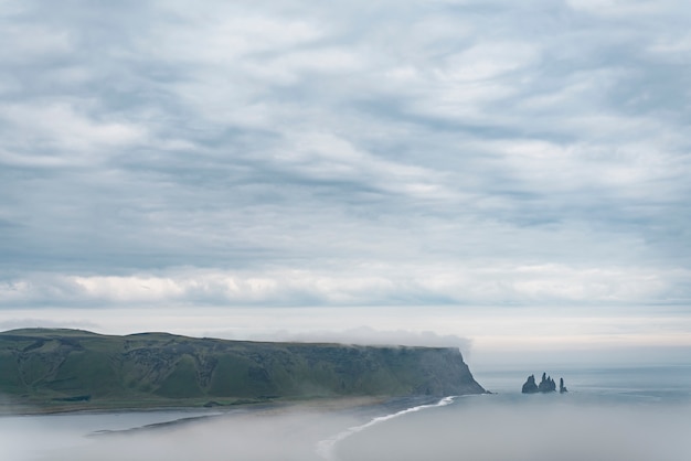 Cloudy nature landscape by lake