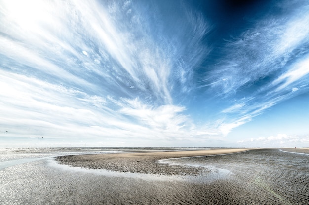 Free photo cloudy sky over dry island