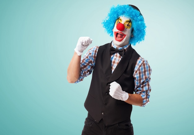 Clown smiling with a fist high