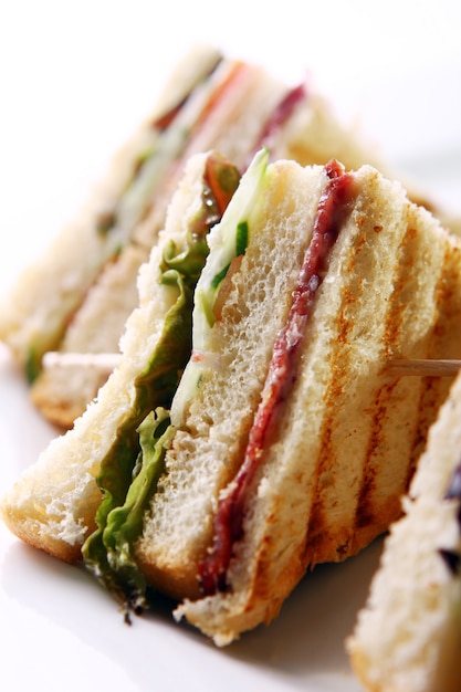 Club sandwich with meat and green