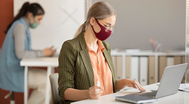 Co workers wearing face mask at work