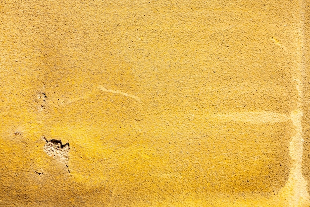 Coarse yellow cement surface