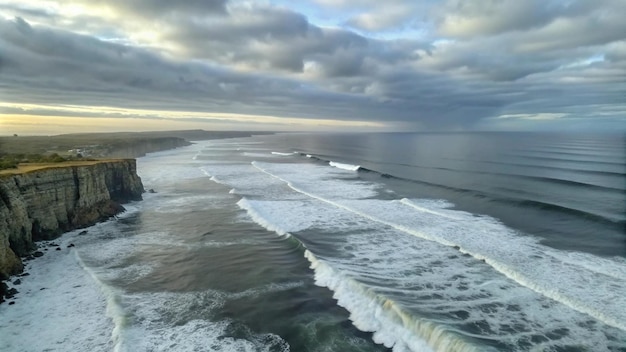 Free Photo coastal cliffs and rolling waves under a cloudy sky