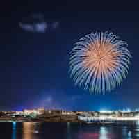 Free photo coastal town with fireworks