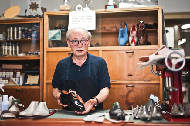 cobbler works in his workshop