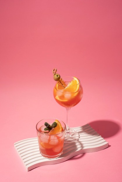 Cocktail glasses with ice cubes and olives