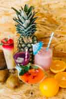 Free photo cocktails and tropical fruits