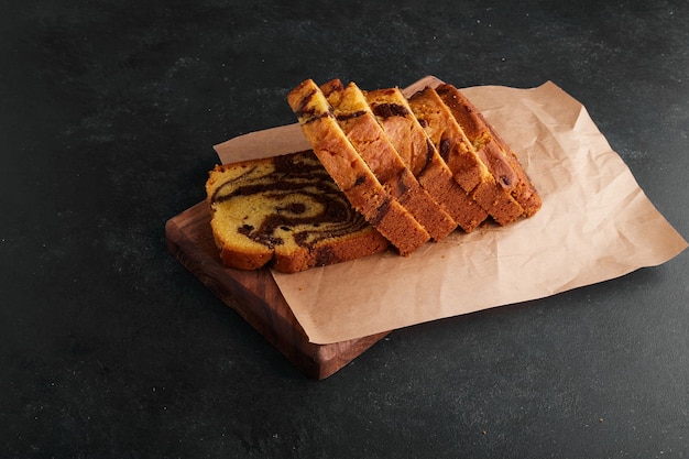 Cocoa pie slices on a wooden board. 