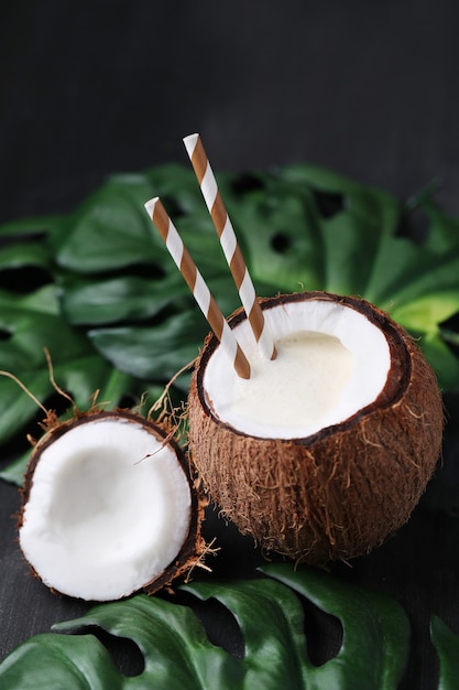 Free Photo coconut cocktail with straw. tropical drink