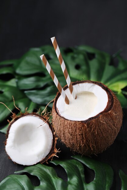 Coconut cocktail with straw. Tropical drink