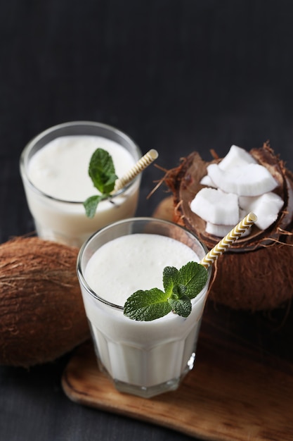 Free Photo coconut cocktail with straw. tropical drink