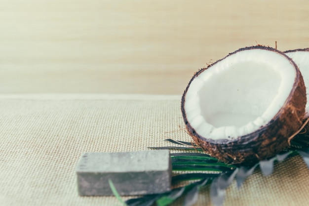 Free Photo coconut and piece of soap