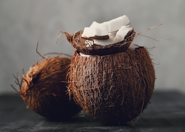 Free Photo coconut slices over coconut. tropical fruit