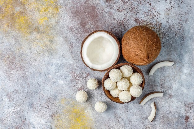 Coconut and white chocolate truffles with half coconut