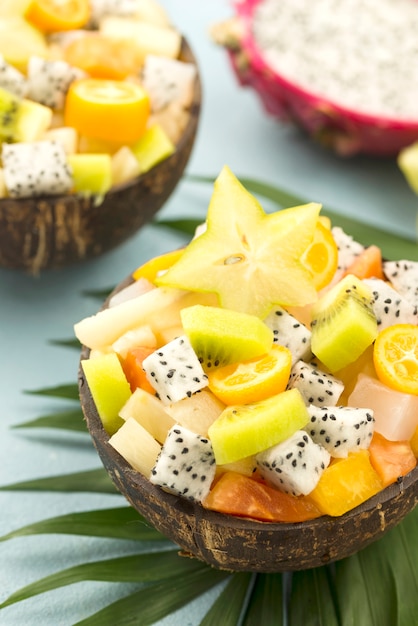 Free Photo coconuts filled with fruit salad high view