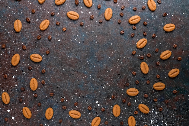 Coffee bean shaped cookies and coffee beans.