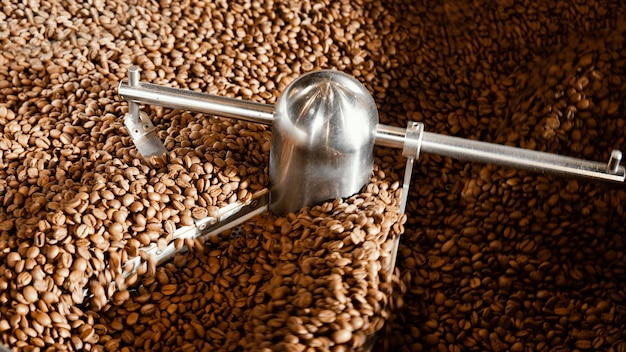 Free photo coffee beans arrangement with machine