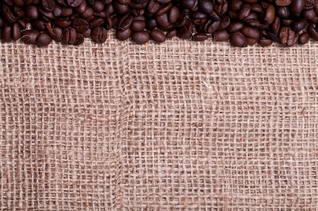 Coffee beans over cloth sack