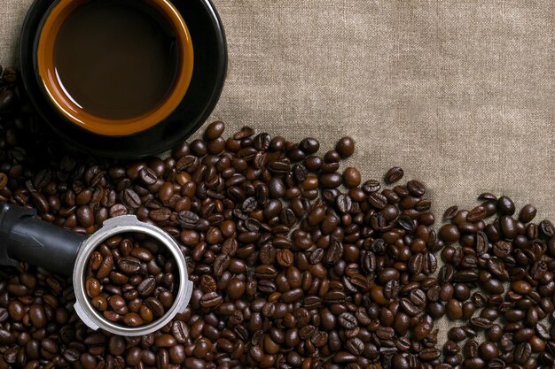 Coffee beans and Coffee cup on a burlap background