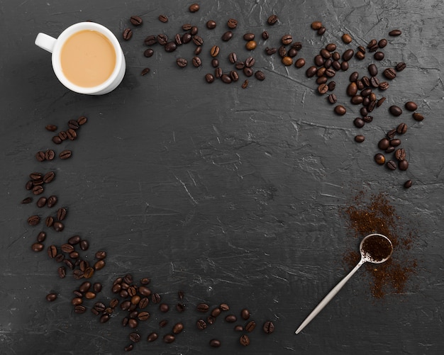 Free photo coffee beans with spoon and copy space