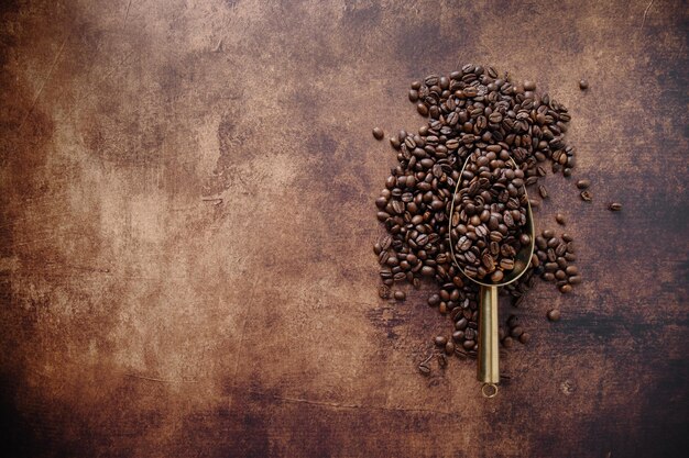 Coffee beans on wooden old background