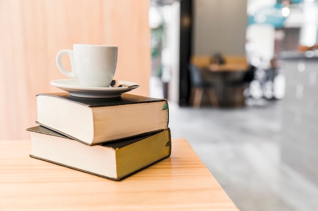 Free Photo coffee over books on wooden table in caf� shop