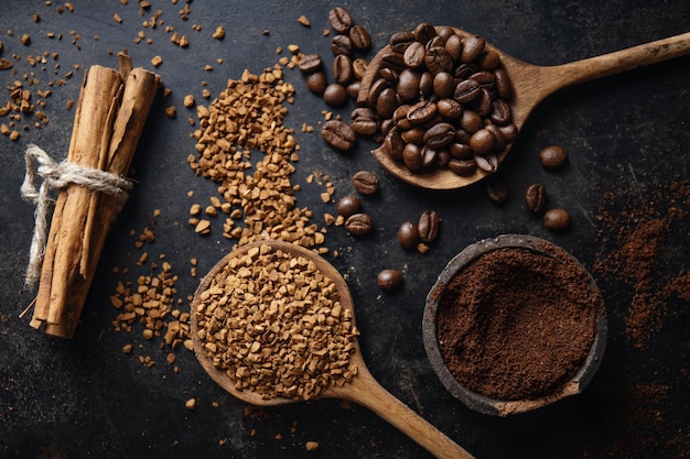 Free Photo coffee concept with ground and instant coffee coffee beans sugar on dark vintage background top view