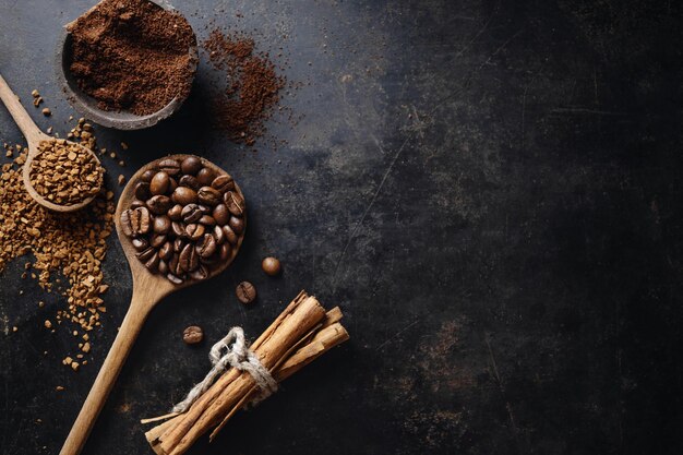 Coffee concept with ground and instant coffee coffee beans sugar on dark vintage background Top View