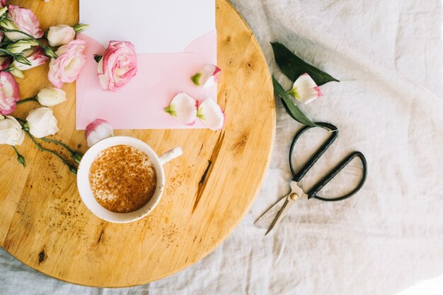 Coffee cup and flowers