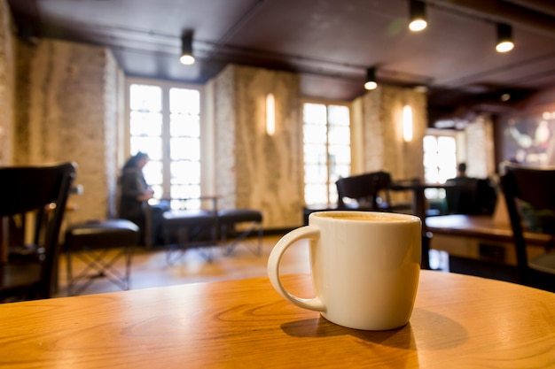 Free Photo coffee cup with blurred background