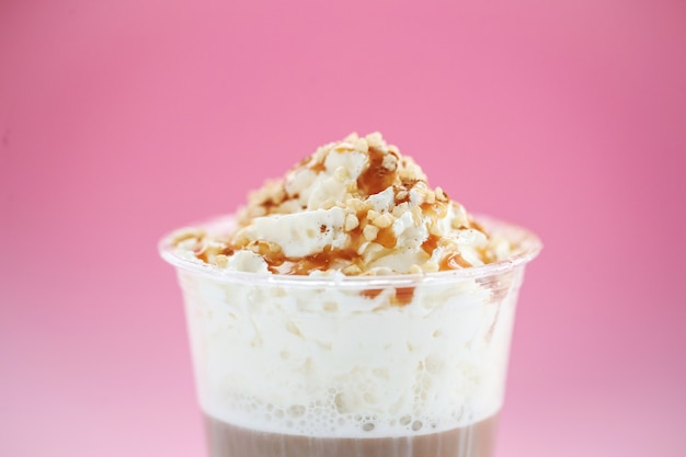 Free photo coffee cup with caramel and whipped cream