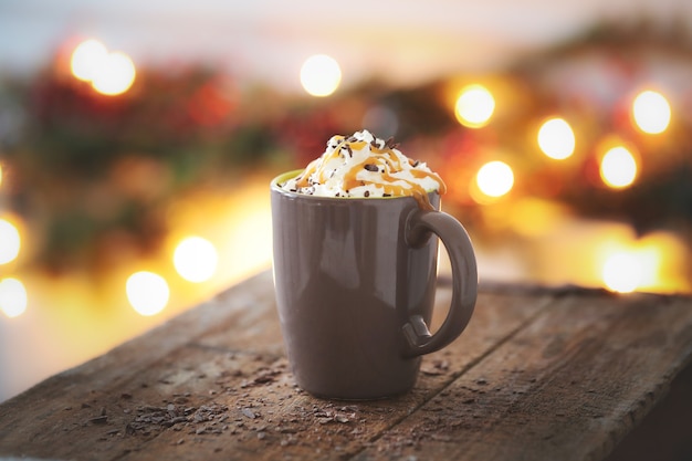 Free photo coffee cup with caramel and whipped cream