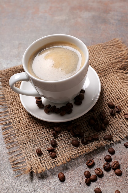 Coffee cup with coffee beans