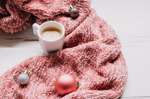 Coffee cup with shiny baubles 